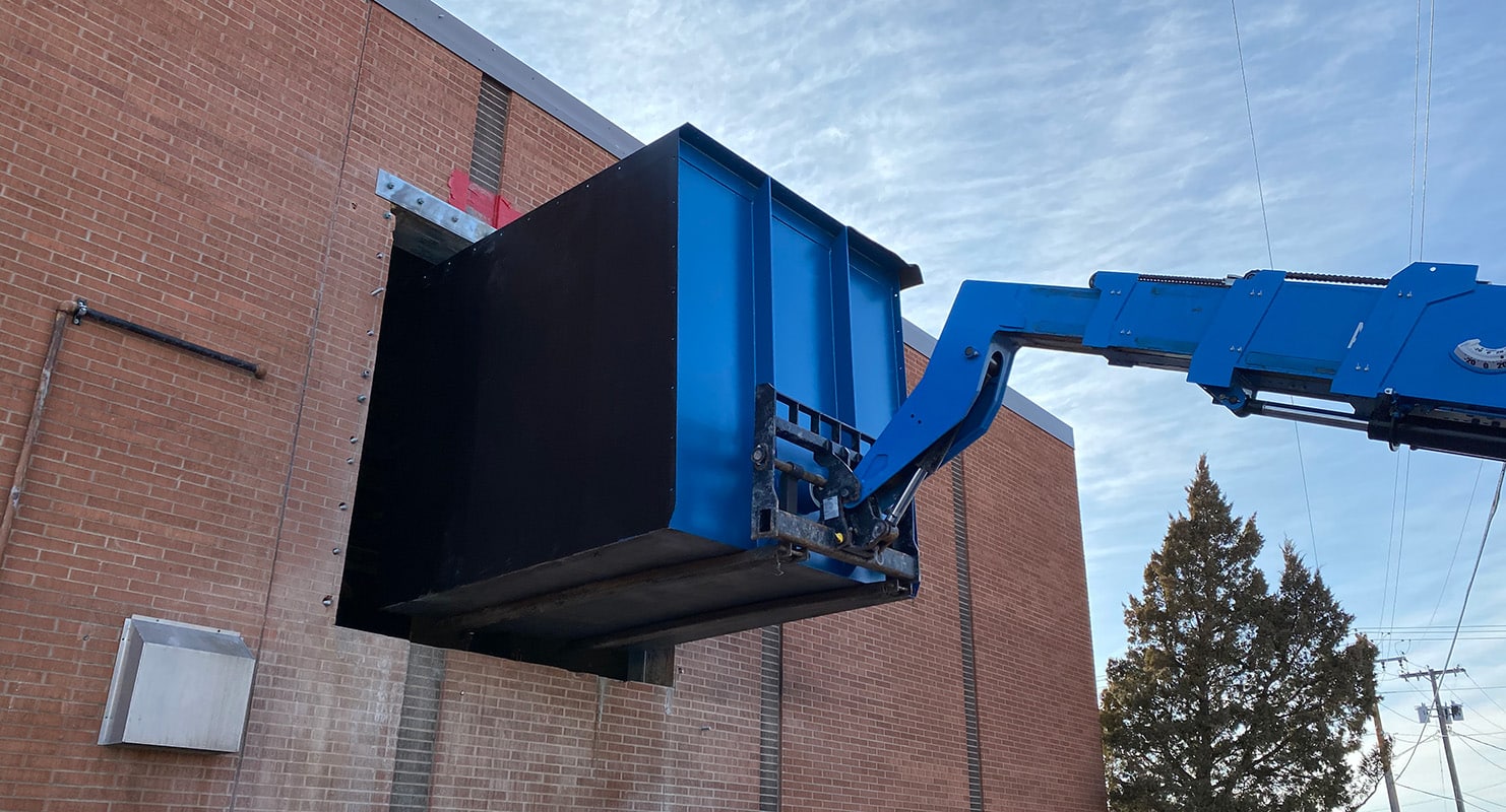 Morrison-Maierle considered going through the roof to install the CAC tanks but then decided to design an overhead door access on the side of the building to get the equipment into the area.